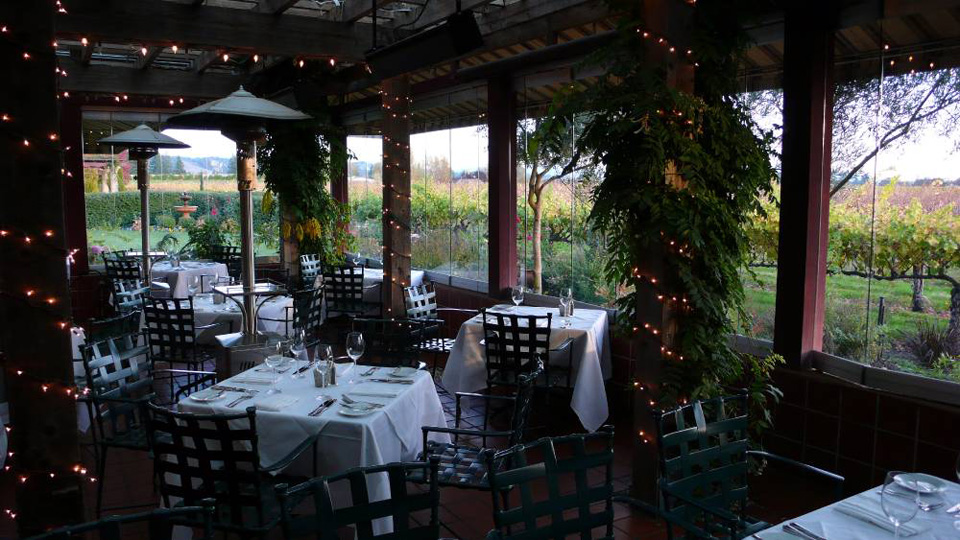 Festive Seating in the Enclosed Patio with a Vineyard View at John Ash & Co.